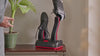 Person placing a sneaker on the ShoeDry Airo shoe dryer