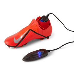 ShoeDry Airo Travel portable shoe dryer in a football boot